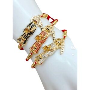 red thread grim reaper bracelets/Pulseras Santa Muerte hilo rojo $20 EACH